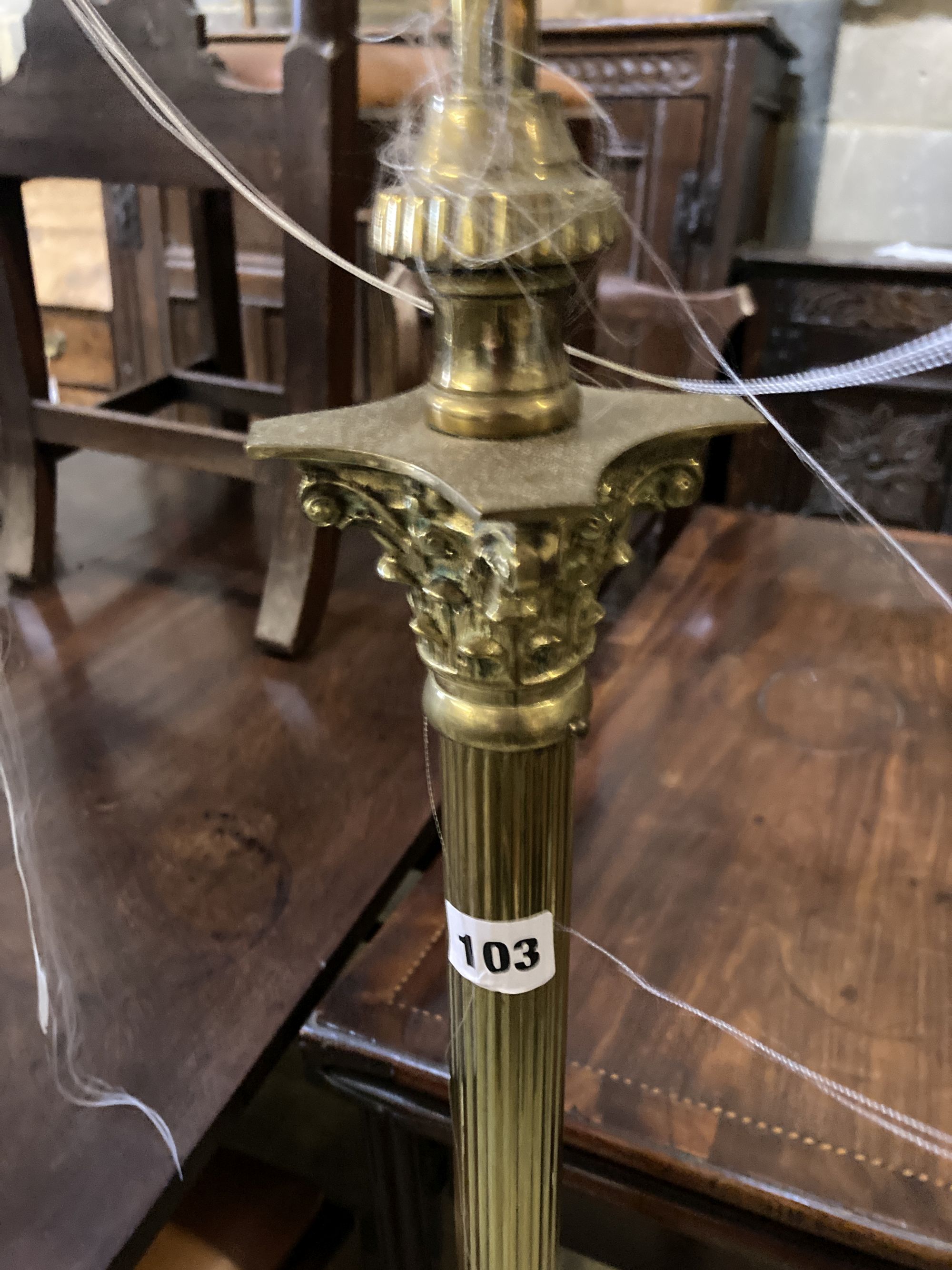 A brass Corinthian column adjustable standard lamp
